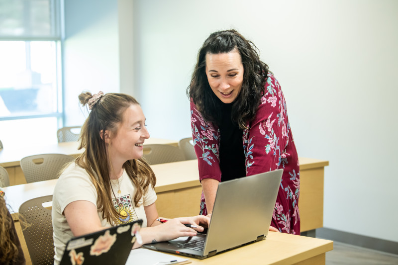 teacher talking with a student