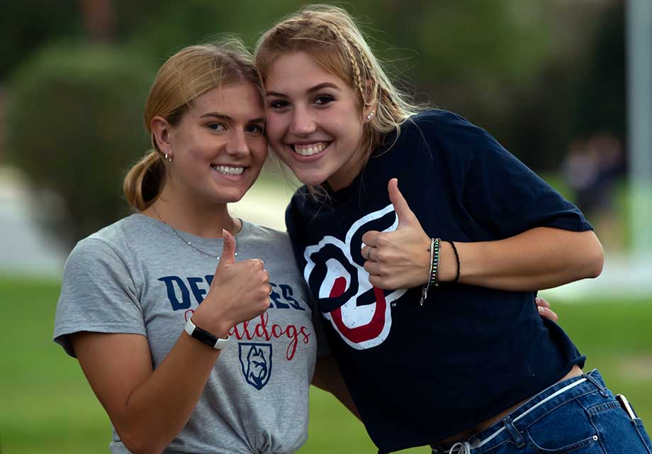 two smiling female students