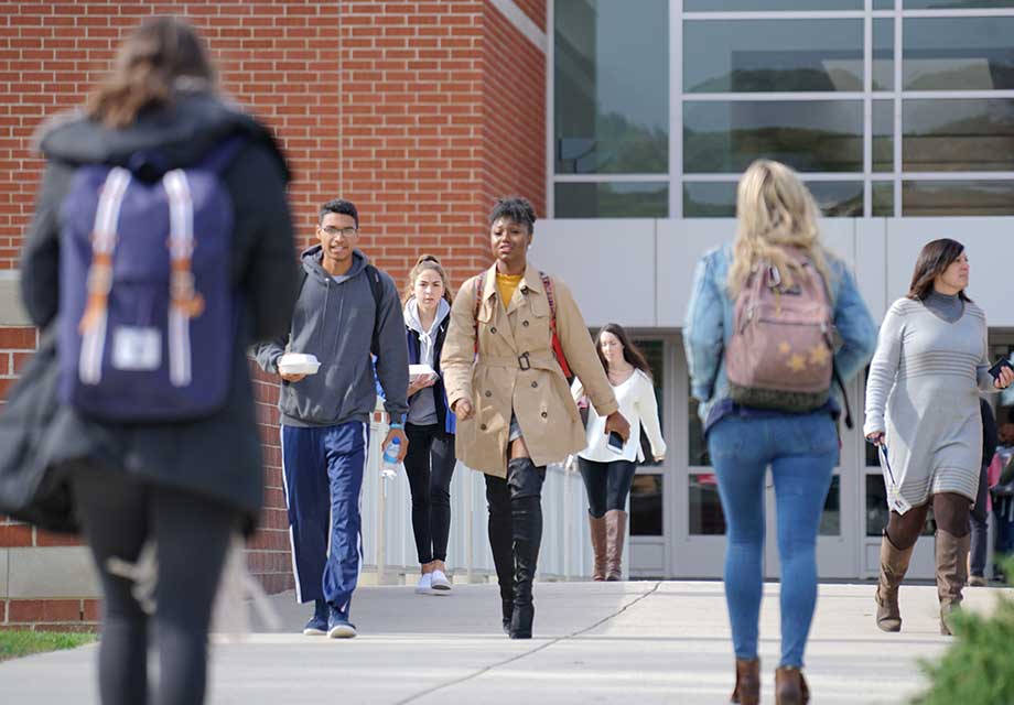 Students walking over Swale Bridge at DeSales University