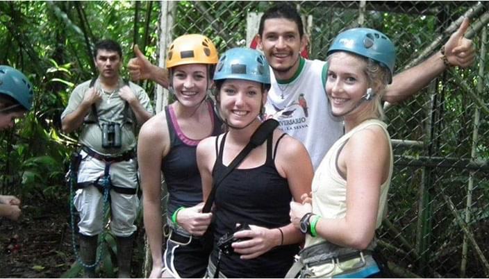 people in zip-line gear