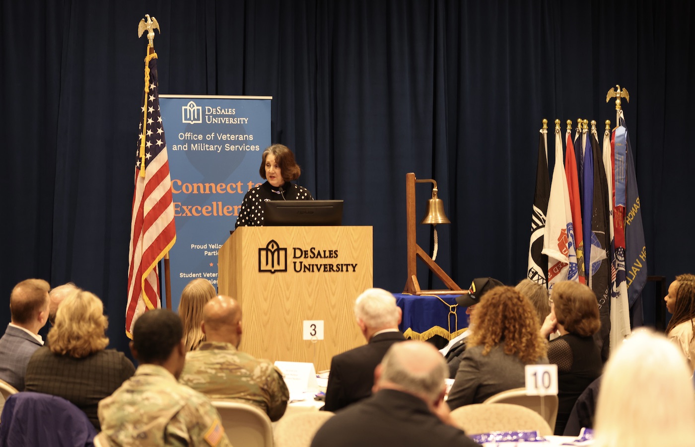 Bobbie Lischak Trotter at podium during Vietnam Commemoration Ceremony