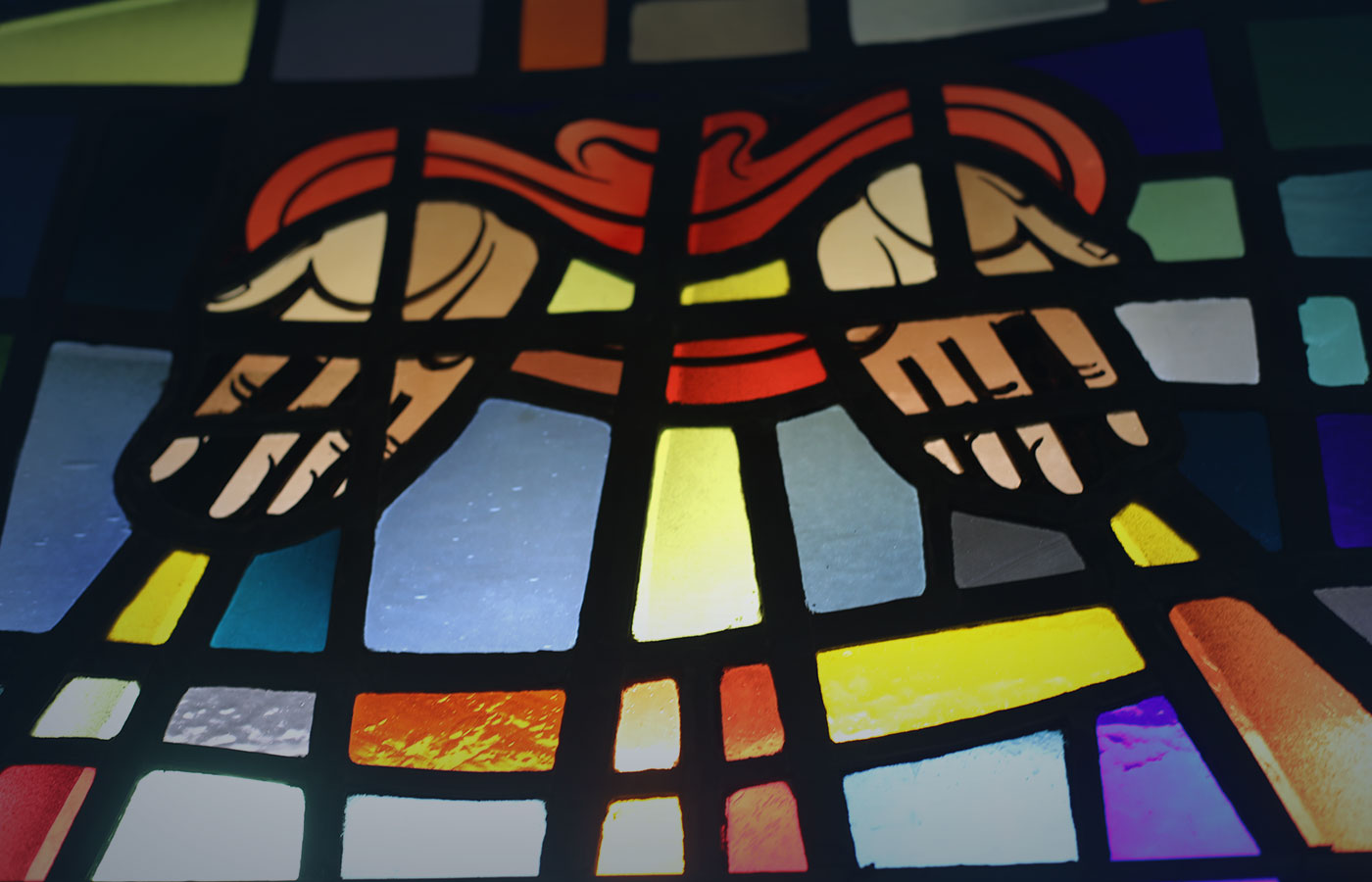 Hands in Prayer Stained Glass at Connelly Chapel 