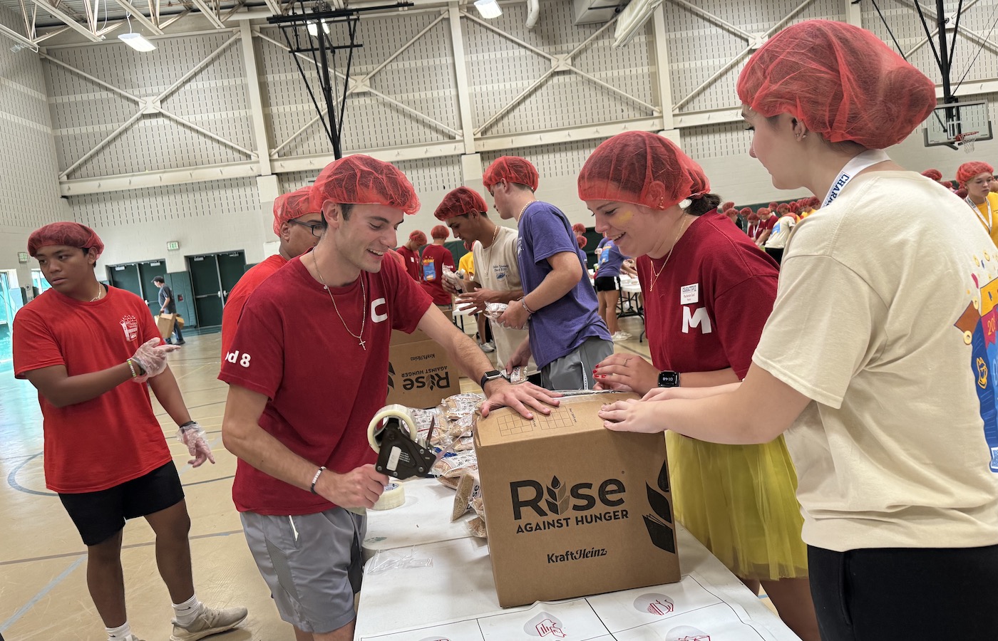 Students packing meals for Rise Against Hunger